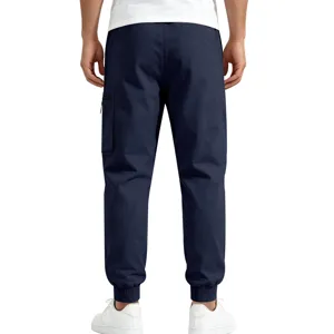 Back detail of men's dark blue cargo pants, featuring side pocket and cuffed hem.