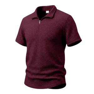Detailed view of men's burgundy waffle knit short sleeve polo shirt with zipper collar.