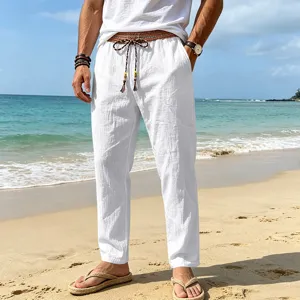 Men's casual white linen pants with tribal drawstring waistband for beach summer wear.