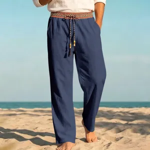 Detail view of men's casual linen beach trousers featuring an ethnic waistband and drawstring.
