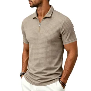 Detailed shot of men's summer short sleeve polo shirt featuring zip collar and textured grid.