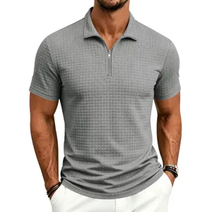 Detail view of men's grey textured grid short sleeve polo shirt with zipper stand collar.