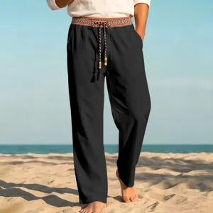 Detailed view of men's casual beach linen trousers featuring ethnic patterned waistband and string.