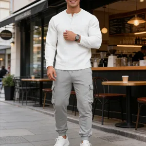 Detail shot of men waffle long sleeve henley shirt and grey cargo sweatpants outfit.