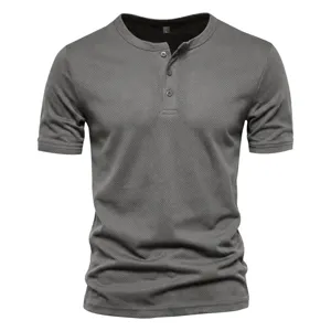 Detailed view of men's short sleeve breathable mesh Henley shirt with button placket in grey.
