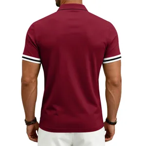 Back detail shot of men's burgundy short sleeve polo shirt featuring contrast striped cuffs.