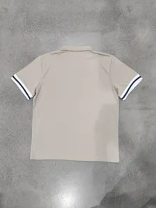Back view detail of men casual short sleeve polo shirt contrast color cuffs khaki top.