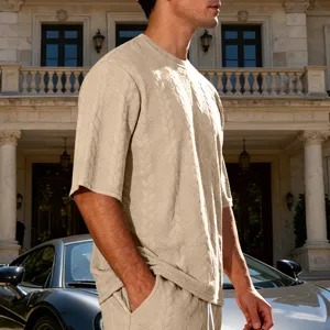 Men's casual knitted short sleeve t-shirt top detailed view in outdoor luxury setting