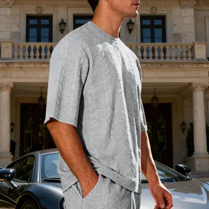 Men's grey jacquard knitted short sleeve t-shirt detail view, high street casual style.