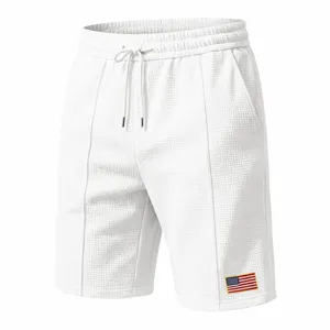 Men white waffle knit casual shorts with flag patch, comfortable sportswear for summer beach wear.