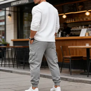 Men casual waffle long sleeve top and grey cargo sweatpants set autumn streetwear outfit.