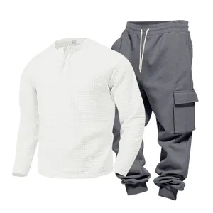 Men's waffle knit long sleeve henley shirt and cargo sweatpants two piece casual outfit.