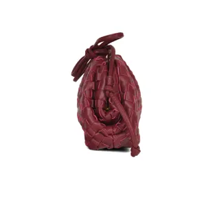 Detailed view of the small burgundy woven leather shoulder bag, trendy clutch.