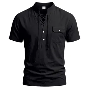 Detail shot of men's black short sleeve linen henley shirt with lace-up front and chest pocket.