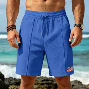 Men's waffle knit casual beach shorts, comfortable summer athletic wear with flag patch.