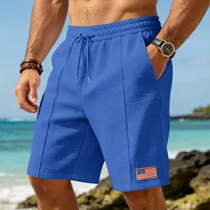 Men's casual beach waffle shorts with drawstring and flag patch for summer outdoor wear.