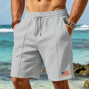 Men's casual grey waffle beach shorts with flag patch, comfortable summer sportswear.