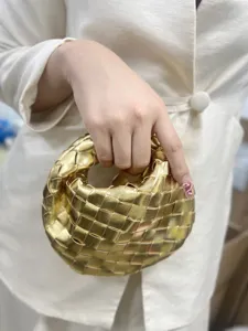 Gold woven leather handbag, stylish handmade braided mini tote bag for women daily use.