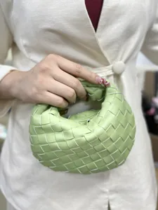 Handwoven leather mini handbag for women stylish minimalist short handle green clutch pouch