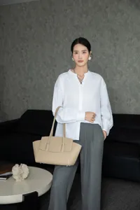 Elegant beige leather tote bag for women, premium minimalist commuter shoulder handbag.
