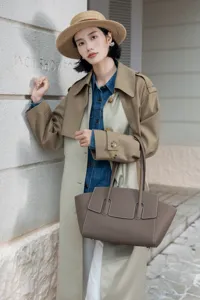 Elegant leather tote bag for women, premium cowhide shoulder bag with structured design.