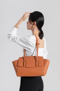 Elegant brown leather tote bag for women, stylish shoulder bag for daily commuting and office.