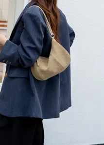 Minimalist suede shoulder bag for women, stylish casual crescent hobo bag for daily wear.