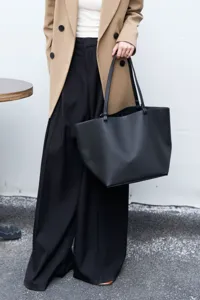 Detailed view of the stylish black leather tote bag showcasing premium texture and large capacity.