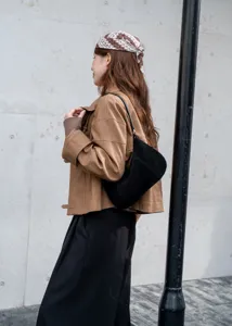 Stylish black suede underarm bag for women, minimalist shoulder bag for autumn and winter daily wear.