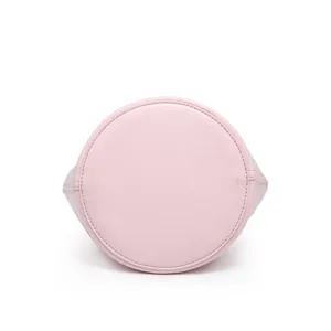 Pink leather bucket bag bottom detail, stylish and versatile everyday crossbody bag for women.