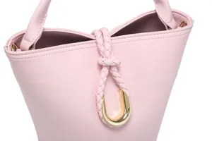 Pink leather bucket bag with braided drawstring and metallic U-shaped closure for women.