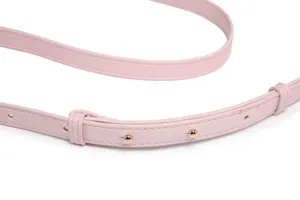 Close-up detail of a pink leather bag replacement strap with gold-tone hardware studs.