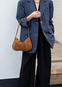 Brown suede underarm bag for women, minimalist shoulder handbag with metallic hardware for autumn.