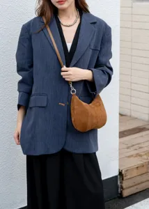 Detailed view of the brown suede underarm shoulder bag showcasing soft texture and minimalist design.