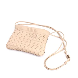 Woven leather crossbody bag detailed view, elegant beige shoulder pouch with slim adjustable strap.