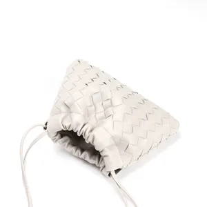 Woven leather dumpling bag with drawstring, chic cloud shoulder crossbody purse for women.