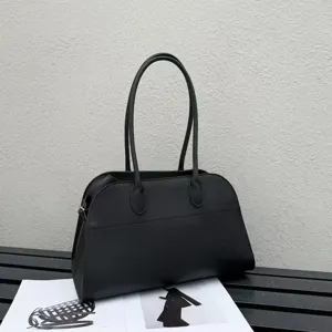 Classic black leather long handle tote bag, elegant minimalist design for women's daily wear.