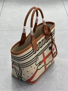 Detailed view of large canvas tote bag with leather trim and equestrian horse graphic design.