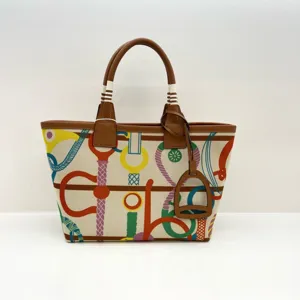 Colorful canvas tote bag with leather handles and equestrian print, large capacity handbag.