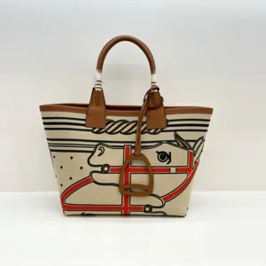 Canvas and leather tote bag featuring a stylish horse graphic and sturdy top handles for daily use.