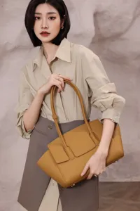 Luxury genuine leather tote bag for women, elegant big eye design shoulder bag for daily use.