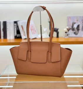 Elegant brown leather tote bag for women, classic design shoulder bag with spacious interior.