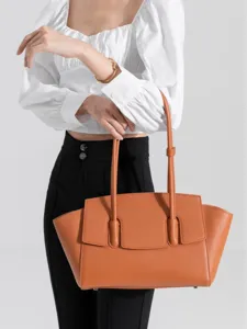 Elegant leather tote bag for women, stylish shoulder bag with large capacity and chic design.