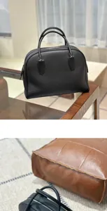 Classic black leather bowling bag, top handles, premium textured cowhide handbag for women.