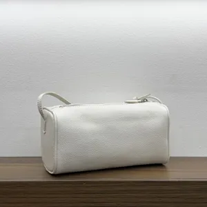 White leather barrel bag stylish 90s pillow shoulder handbag for women daily casual wear.