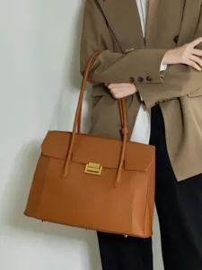 Premium brown leather tote bag for women, classic structured work handbag with top handles.
