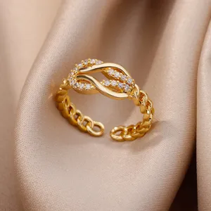Close-up of 18K gold-plated adjustable ring with cubic zirconia leaf design