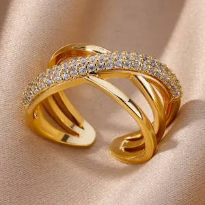 Close-up detail of 18K gold plated multi-layer crossover ring with CZ stones