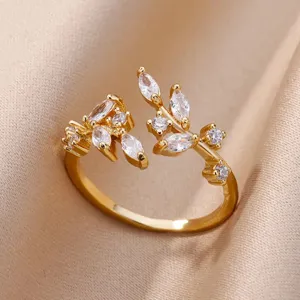 Macro view showing the detailed zircon leaf design on a gold plated adjustable open ring