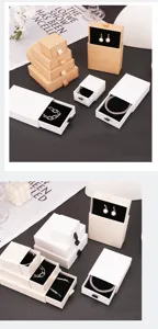 Detail of premium paper jewelry drawer boxes with black foam inserts in white and kraft colors
